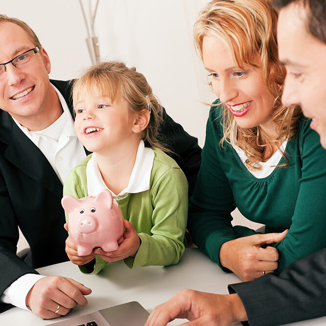 Family with their consultant (assets, money or similar) doing some financial planning - symbolized by a piggy bank the daughter is holding in her hand