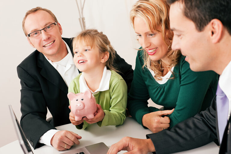 Family with their consultant (assets, money or similar) doing some financial planning - symbolized by a piggy bank the daughter is holding in her hand