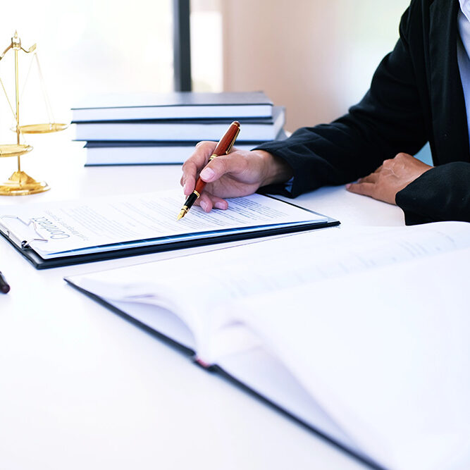 Female lawyer Legal counsel presents to the client a signed contract with gavel and legal law. justice and lawyer woman business concept