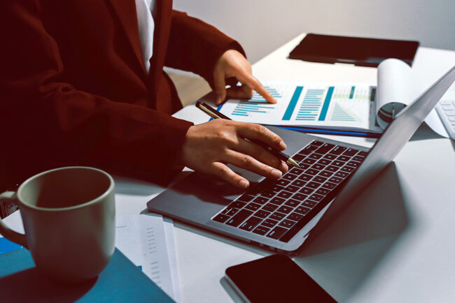 Tax deduction planning concept. Women use a calculator to calculate expenses and taxes to receive tax deductions for personal individual Income. tax return for individual persons.monthly expenses